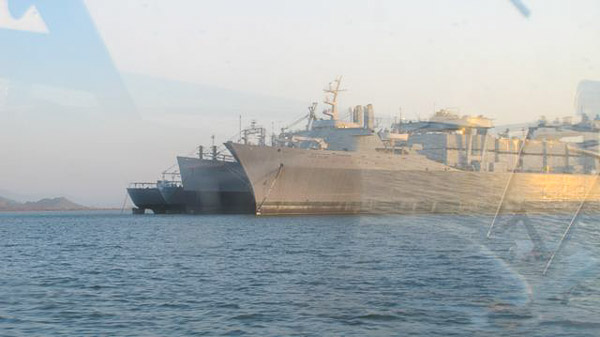 Sturgeon fishing on Suison Bay, mothball fleet