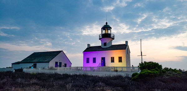 Cabrillo National Monument lighthouse lite in purple in gold to commorate the passing in the 19th amendment for women's right to vote