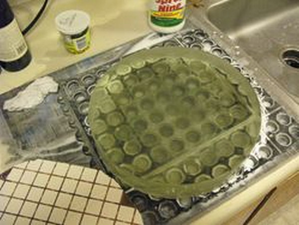 Grinding with the finer grits is slower, but the glass is starting to clear up as the scratches are removed